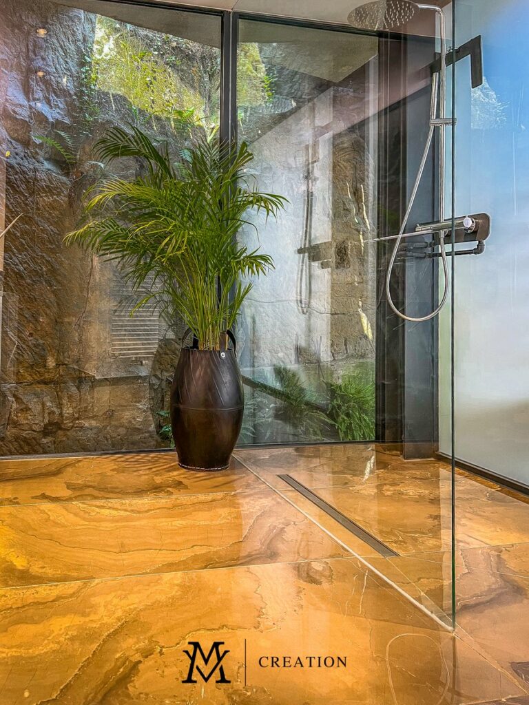 Beautiful spa-like shower with outdoor view and beautiful marble flooring of house for sale in Rollingergrund Luxembourg