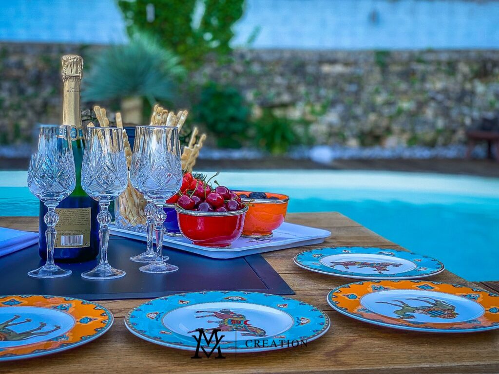 Garden view of a table with a pool in the background of a house for sale in Rollingergrund Luxembourg