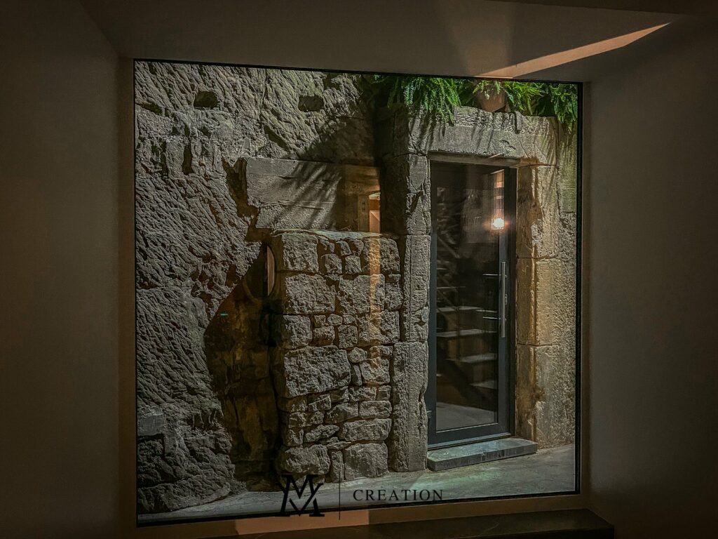 View on original ancient-style brick walling through window in house for sale in Rollingergrund Luxembourg